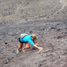 Lindsay climbing up the volcanic scree, hand over hand!